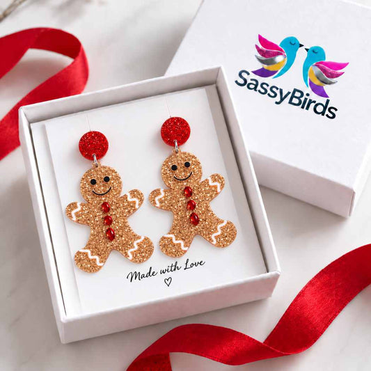 Glitter gingerbread man Christmas statement earrings with red glitter studs and festive icing details