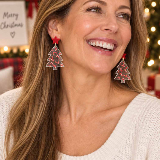 Clear acrylic Christmas tree earrings with red candy cane pattern and red star studs