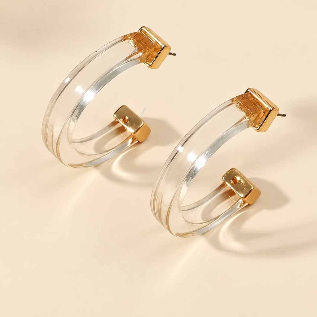 Modern clear hoop earrings with gold detail by SassyBirds
