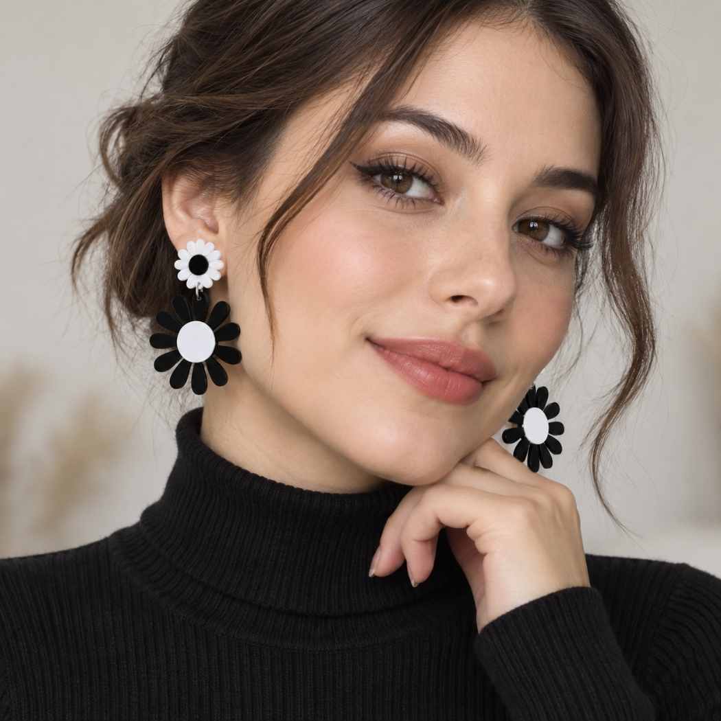 Black and white daisy acrylic statement earrings with floral drop design