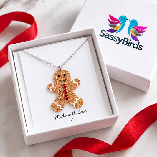 Glitter gingerbread man Christmas necklace with red button details on a silver-tone chain