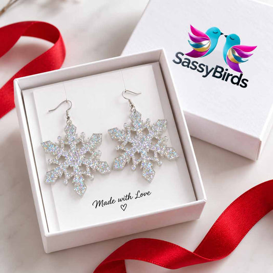 Silver glitter acrylic snowflake statement earrings worn with a cream winter outfit