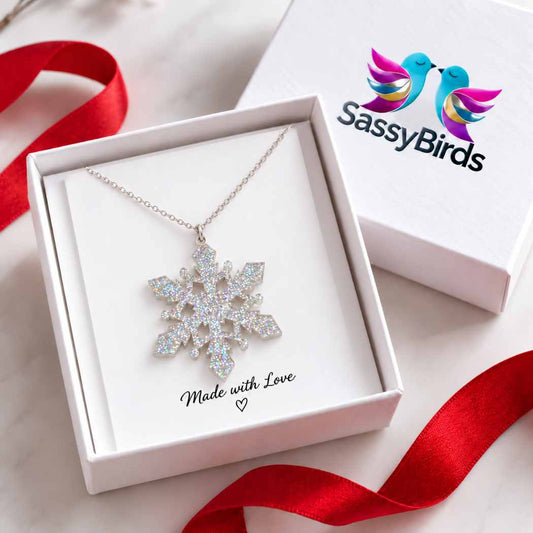 Silver glitter acrylic snowflake necklace on a delicate silver-tone chain in jewellery box