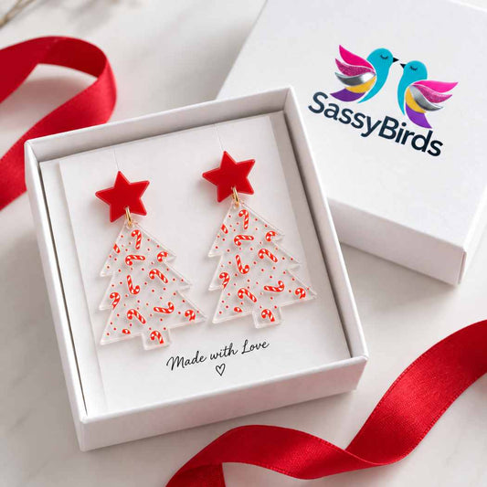 Clear acrylic Christmas tree earrings with red candy cane pattern and red star studs