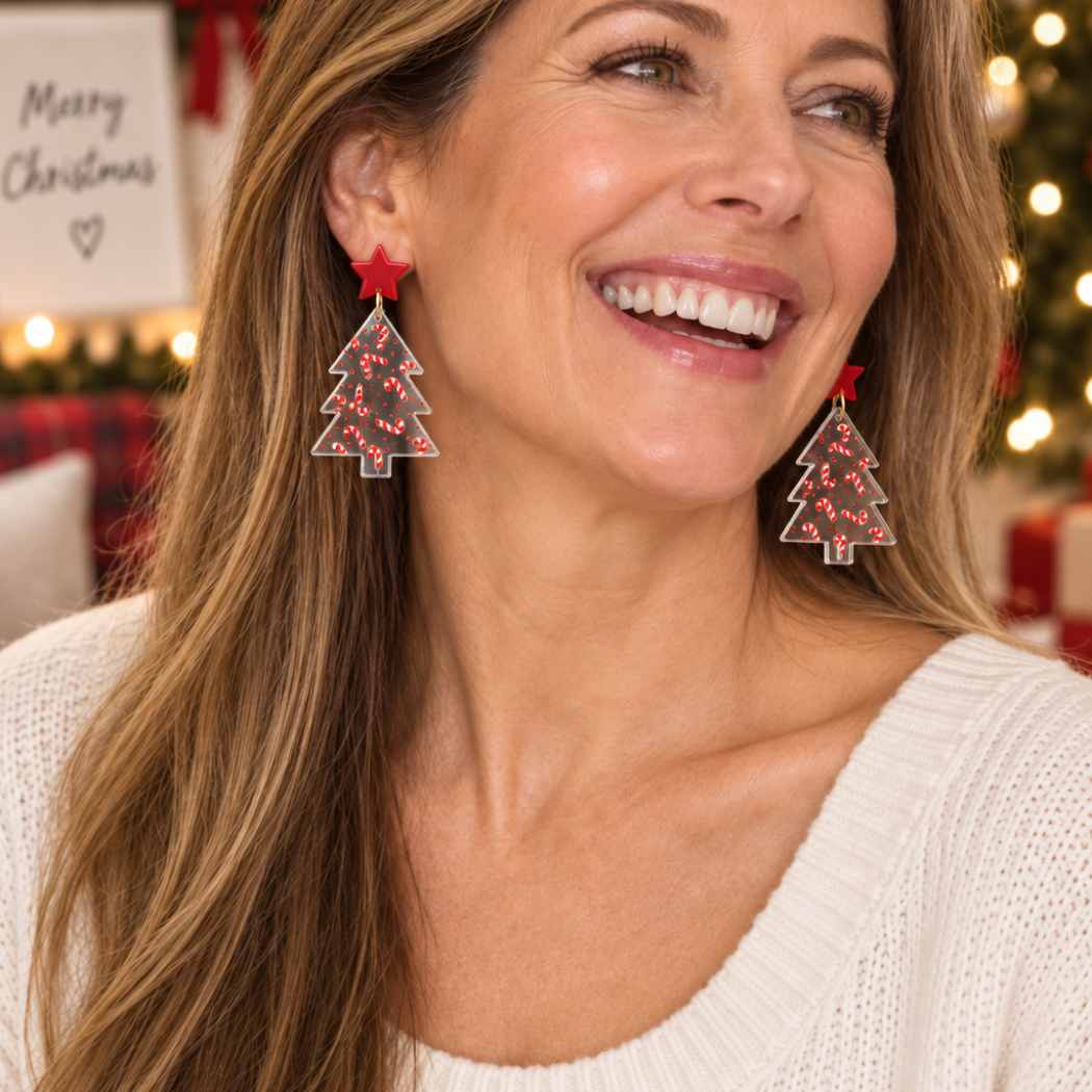 Clear acrylic Christmas tree earrings with red candy cane pattern and red star studs