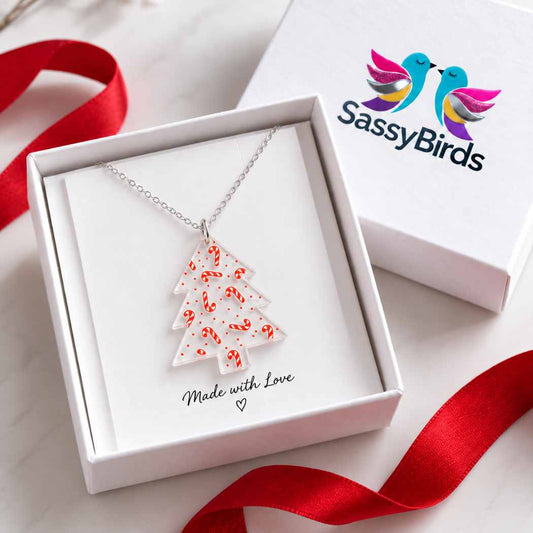 Clear acrylic Christmas tree necklace with red candy cane details on a delicate silver-tone chain