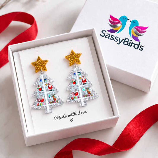 Silver glitter acrylic Christmas tree earrings with colourful festive illustrations and gold star studs