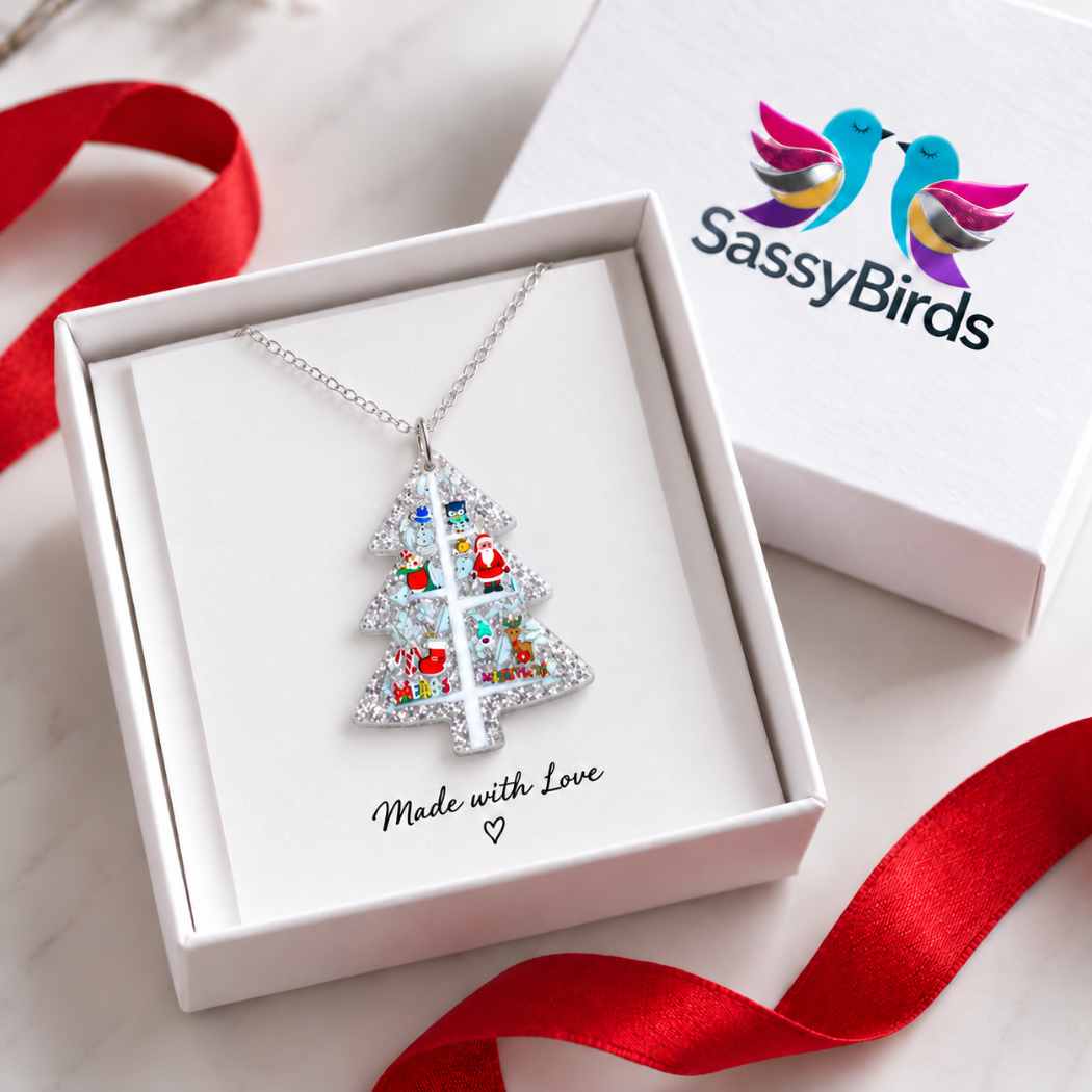 Silver glitter acrylic Christmas tree necklace with colourful festive character details on a silver-tone chain