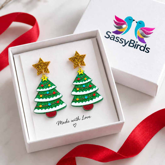 Green glitter acrylic Christmas tree earrings with gold star studs and colourful festive decorations
