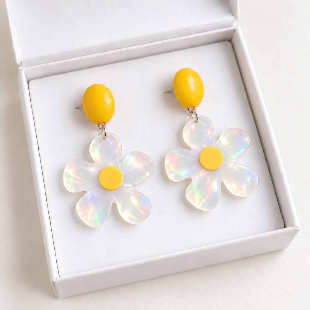Daisy earrings displayed in white jewellery box