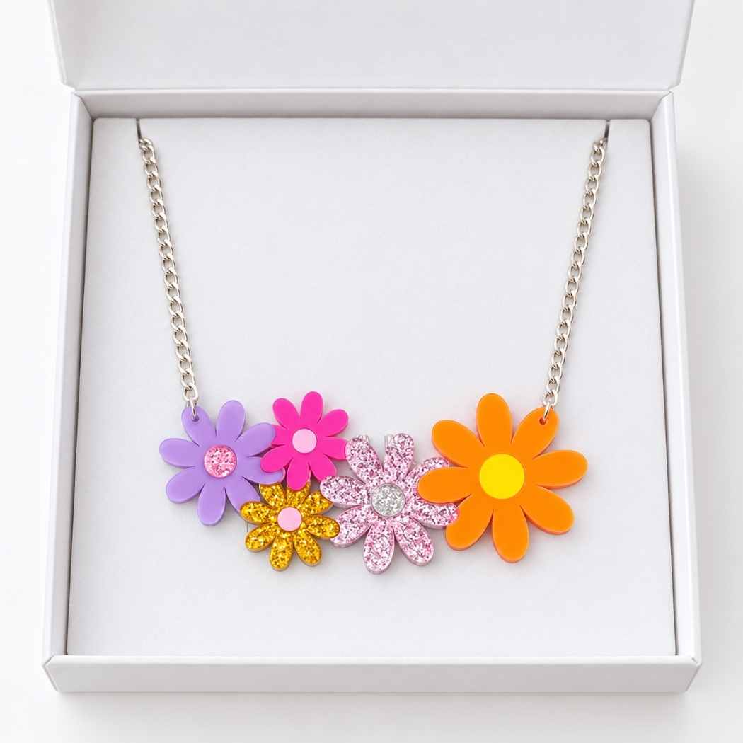 Colourful floral daisy flower necklace displayed in white jewellery box