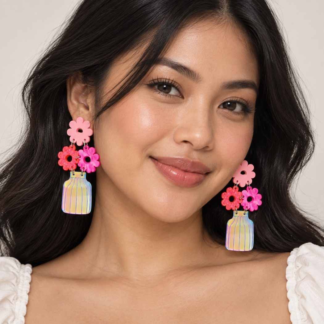 Floral acrylic earrings with pink flowers and vase design on model