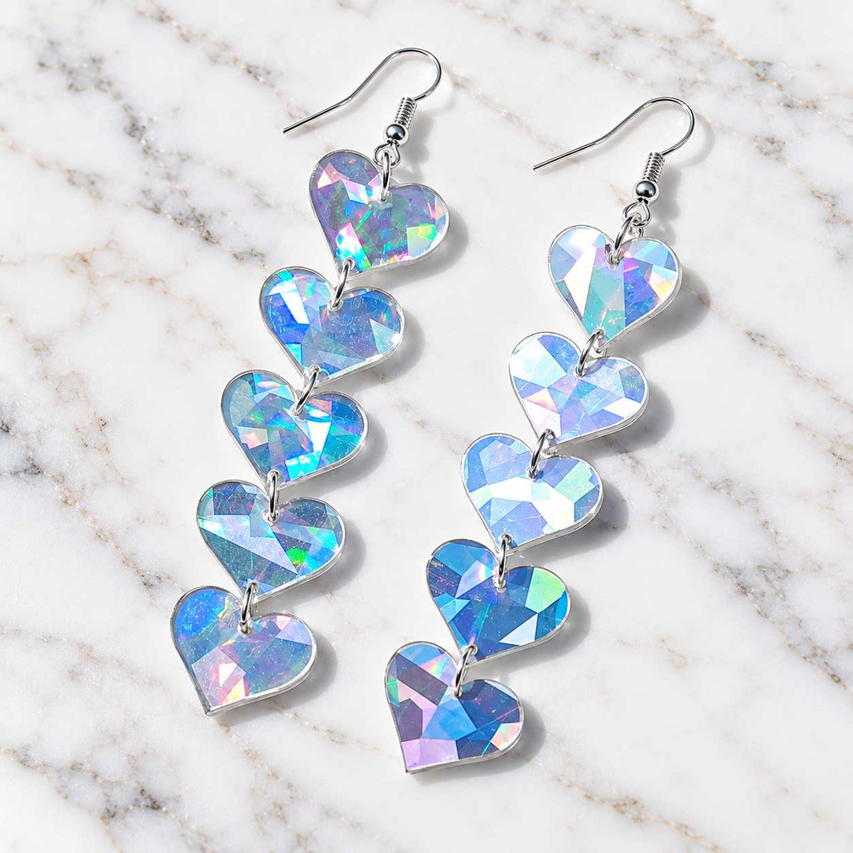 Iridescent acrylic heart drop earrings with five dangling hearts and silver hooks