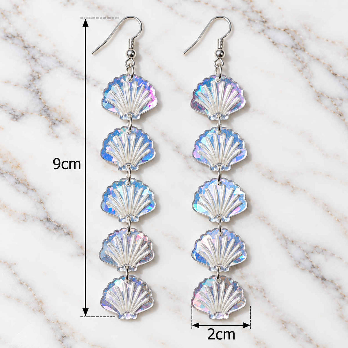 Five-shell cascading acrylic earrings showing total drop length
